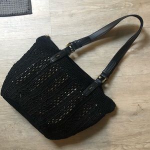 The Sak black crochet and gold underlay purse